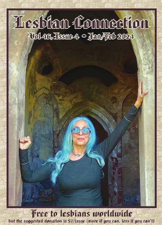gothic castle doorway w/fluorescent blue-haired woman in matching sunglasses in doorway