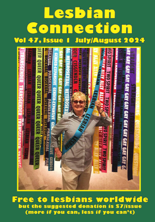 LC cover image for Volume 47 Issue 1, depicts subscriber, Diane Germain, taken in 2018 at the first LGBTQ exhibit at the San Diego History Center. Photo taken by Angela Brinskele. Diane is grinning while proudly draping a sash with the word "LESBIAN" written on it several times. She chose that sash from several others with other LGBTQ labels hanging from a display.
